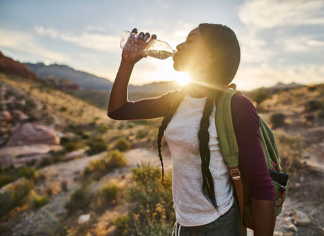 Woman drinking water on hike